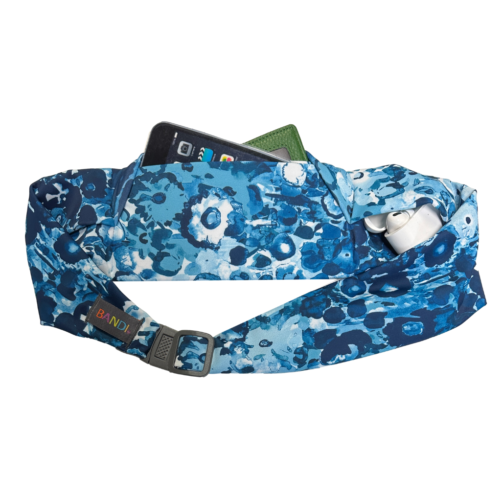BANDI Wear Pocketed Belt in Lagoon print.  Blue and white floral print and showing items in pocket.